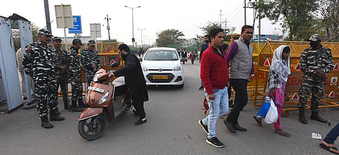 Police remove barricade in Shaheen Bagh for opening traffic from Kalindi Kunj Road to Noida in New Delhi. (Photo| EPS)
