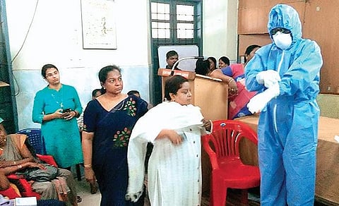 A health official demonstrating how to wear protective gear as part of the prevention of novel coronavirus in Alappuzha on Monday | Express