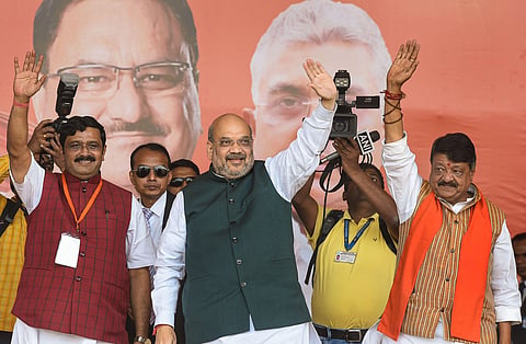 Union Home Minister Amit Shah with BJP national general secretary Kailash Vijayvargiya R and National Secretary Rahul Sinha L during a rally at Shaheed Minar Ground in Kolkata Sunday March 1 2020. (Photo | PTI)