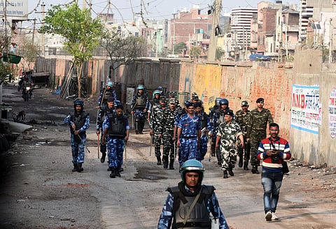 Security personnel on patrol at a northeast Delhi locality on Sunday. (Photo | Parveen Negi, EPS)