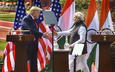 Prime Minister Narendra Modi (R) and US President Donald Trump exchange greetings after their joint press statement. (Photo | PTI)