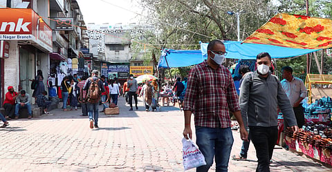 People wear protective masks as a precaution measure against the coronavirus outbreak at Sarojini Market in New Delhi on Monday. (Photo | Ashish Kumar Kataria/EPS)