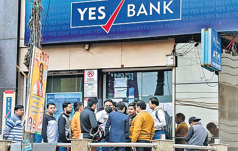 Account holders stand in a queue to withdraw money from YES Bank in New Delhi after the RBI moratorium. (Photo | PTI)