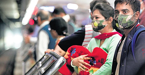Passengers wear masks on a platform at a metro station to keep out the corona threat | express