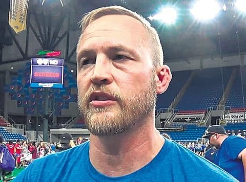India’s women’s wrestling coach Andrew Cook has returned home.