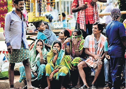 Daily wage labourers waiting for work. (Photo | EPS/Biswanath)