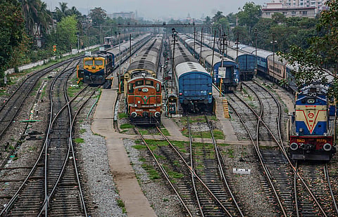 Trains stand parked at a deserted railway station during 'Janata curfew' in the wake of coronavirus pandemic in Guwahati. (Photo | PTI)