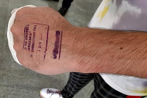 A passenger being stamped after screening at Mangaluru airport. This image is used for representational purposes. (Photo | EPS)