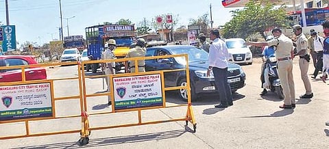 Vehicles being checked at Talapady checkpost in Mangaluru on Saturday | express