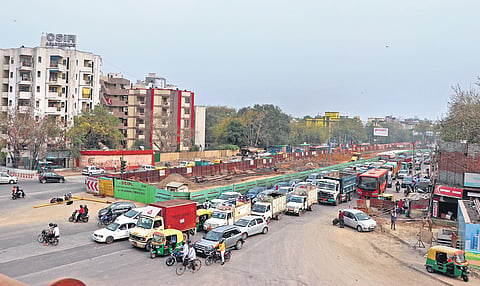 A view of the Ashram Chowk where work is underway to create more space for pedestrians and cyclists. The work is likely to be completed by September (Photo | Ashish Kumar Kataria, EPS)