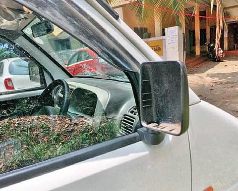 The shattered side-view mirror of the car belonging to Eben Telecom