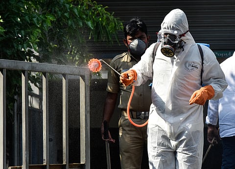 Spraying sanitation chemical at Ram koti in Hyderabad on Friday during lockdown till April 14th in view of coronavirus. (Photo | Vinay Madapur/EPS)