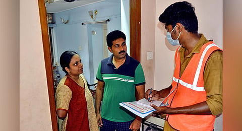 A Health Department employee conducting door-to-door enquiry in Mylapore on Sunday. (Photo | EPS/D Sampath Kumar)