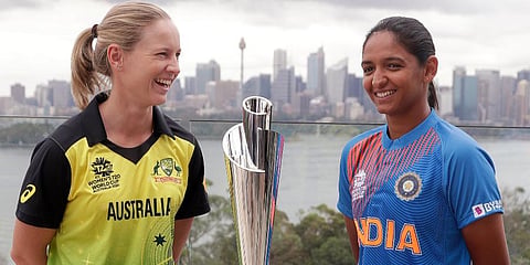 Cricket captains Meg Lanning of Australia, left, and Harmanpreet Kaur of India pose for a photo with the trophy. (Photo | AP)