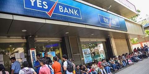 Account holders queue up outside Yes Bank to withdraw money in Mumbai on Saturday. (File photo| PTI)
