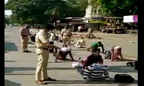 Cops in Pune make people violationg lockdown do yoga. (Photo| ANI)