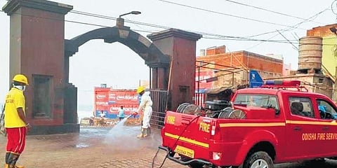 The entrance of Swargadwar being sanitised by fire personnel (Photo | EPS)
