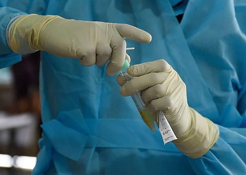 A doctor conducts a swab test during the nationwide lockdown to curb the spread of coronavirus at CSMT in Mumbai. (Photo | PTI)
