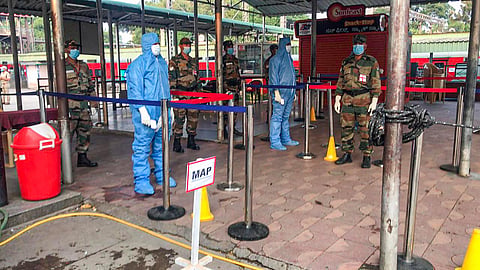 Army doctors wait to screen army personnel who were to board a special train for Jammu for their deployment in the border areas amid the COVID-19 lockdown at the railway station in Bengaluru Friday April 17 2020. (Photo | PTI)