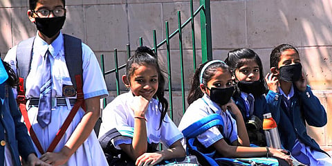 Students wearing masks as a precautionary measure amid the coronavirus outbreak as they wait outside the examination center. (File photo| ANI)