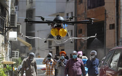 South Delhi Municipal corporation staff use drone to spray disinfectant in nizamuddin area on Friday. (Photo | Anil Shakya, EPS)