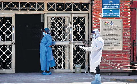 Medical staff wear protective suit outside a city hospital. (Photo | Anil Shakya, EPS)