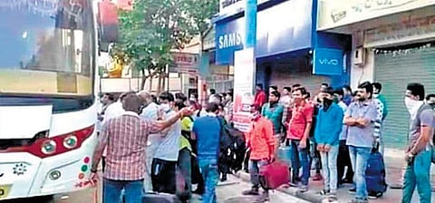 Odia workers boarding a bus at Surat on Monday I Express