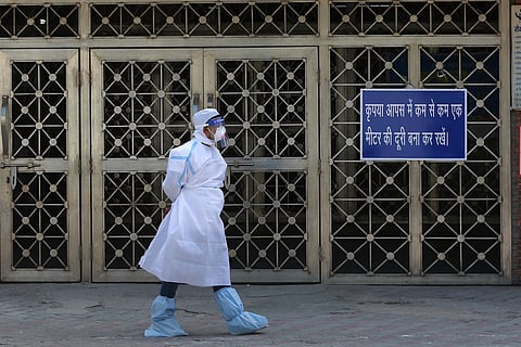 A Health worker wearing protective gear is seen at LNJP Hospital as a precaution in wake of coronavirus pandemic during the nationwide lockdown in New Delhi on Friday. (Photo | Shekhar Yadav/EPS)