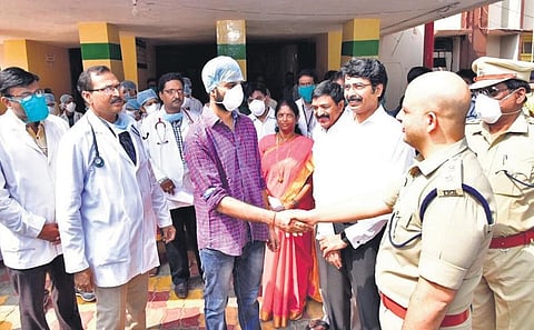 The youngster who recovered interacts with Collector Muralidhar Reddy, SP Nayeem Asim, MP V Geetha Viswanath, MLA D Chandra Sekhar Reddy and other officials in Kakinada on Friday (Photo | EPS)
