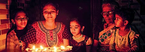 Citizens in Bengaluru were seen following the PM’s appeal to light lamps on Sunday | express