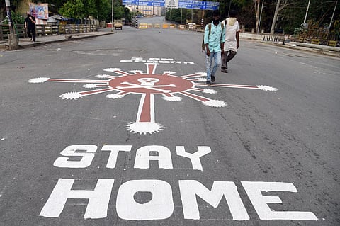 Coronavirus awareness message painted on a road in Bengaluru as number of infections keep rising in the country. (Photo | Nagaraja Gadekal,EPS)