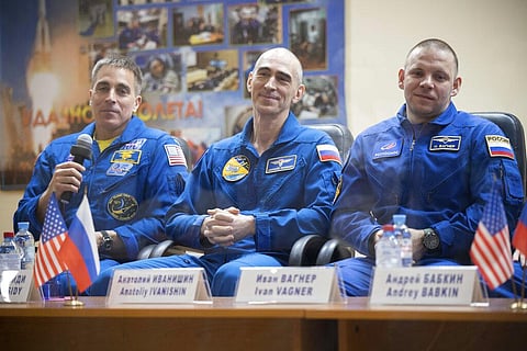 U.S. astronaut Chris Cassidy, left, Russian cosmonauts Anatoly Ivanishin, centre, and Ivan Vagner, members of the main crew to the International Space Station (ISS), attend a news conference at the Baikonur Cosmodrome, Kazakhstan. (Photo | AP)
