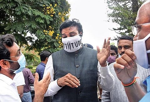 Minister B Sriramulu interacting with officials on the measures taken to fight Covid-19 in the district at the Zilla Panchayat auditorium in Mysuru on Wednesday | Udayshankar S