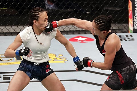 Carla Esparza, right, lands a punch on Michelle Waterson during a UFC 249 mixed martial arts bout, Saturday, May 9, 2020, in Jacksonville, Fla. (Photo | AP)