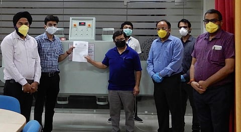 The IIT-Roorkee team with their machine.