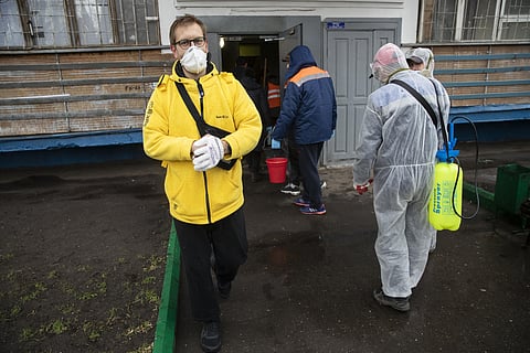 Russian businessman Sergey Nochovnyy wears a face mask to protect against coronavirus. (Photo| AP)