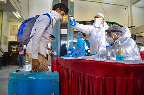 Migrant labourers being screened by medics on their arrival at Habibganj railway station from Panvel Maharashtra by a special train amid ongoing COVID-19 lockdown in Bhopal Thursday May 7 2020. (Photo | PTI)