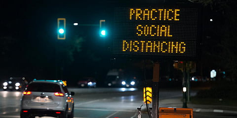 A sign reminding people about 'social distancing' in the midst of the coronavirus outbreak. (File photo| AP)