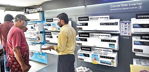 A salesman attends to customers at an electronics shop at AS Rao Nagar on Saturday after the government relaxed the lockdown norms | VINAY MADAPU