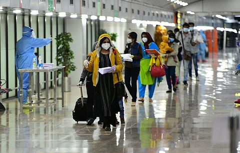 Passengers of the Doha-Thiruvananthapuram flight at Thiruvananthapuram International Airport. (Photo | Special arrangement)