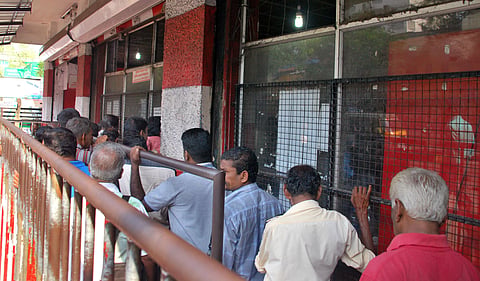 Consumers waiting in long queue at Bevco outlet in Kottayam during the pre-coronavirus days. (File Photo | EPS)