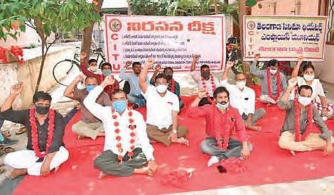 Telangana cinema theatre employees along with CITU members stage a protest.