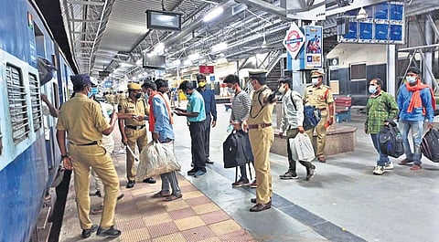 Migrant labourers boarding the special train arranged by the Telangana government to send them back to their native places in Jharkhand, at Lingampally railway station in Hyderabad on Friday