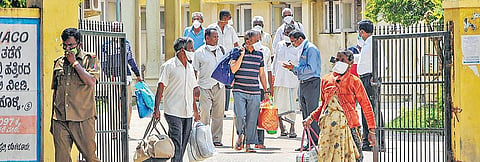 Patients who recovered from COVID-19 leave after being discharged from a hospital in Chikmagalur on Saturday | PTI