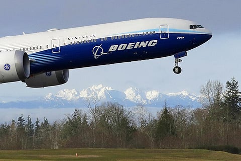 In this Jan. 25, 2020, file photo a Boeing 777X airplane takes off on its first flight with the Olympic Mountains in the background at Paine Field in Everett, Wash. (Photo | AP)
