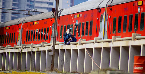 A labourer seen at the KSR Railway station in Bengaluru. (Photo | Pandarinath, EPS)