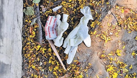 Despite the health risks they pose, used gloves and face masks are being casually thrown away across the city. (Photo | Debadatta Mallick, Ashwin Prasath/EPS)