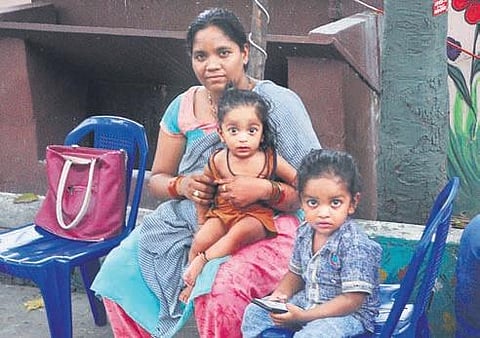 Migrant workers wait to return to their houses, at a GVMC shelter in Visakhapatnam on Sunday. (Photo| G SatyanarayanaM, EPS)