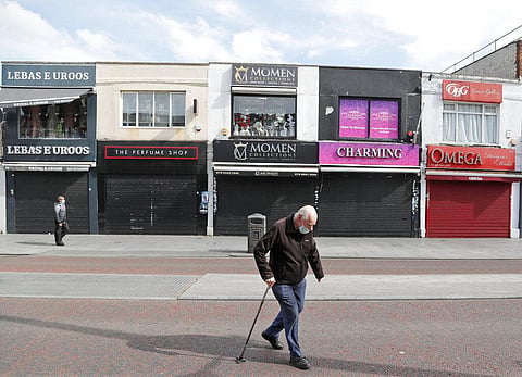 Pedestrians walk along side closed shops during the coronavirus lockdown in London, Tuesday, May 5, 2020. Whilst a few European countries relax the COVID-19 lockdown, Britain still remains under lockdown without an exit strategy yet. (Photo | AP)
