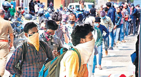 People waiting at the commercial tax checkpost at Walayar for verification of their documents on Tuesday | Express